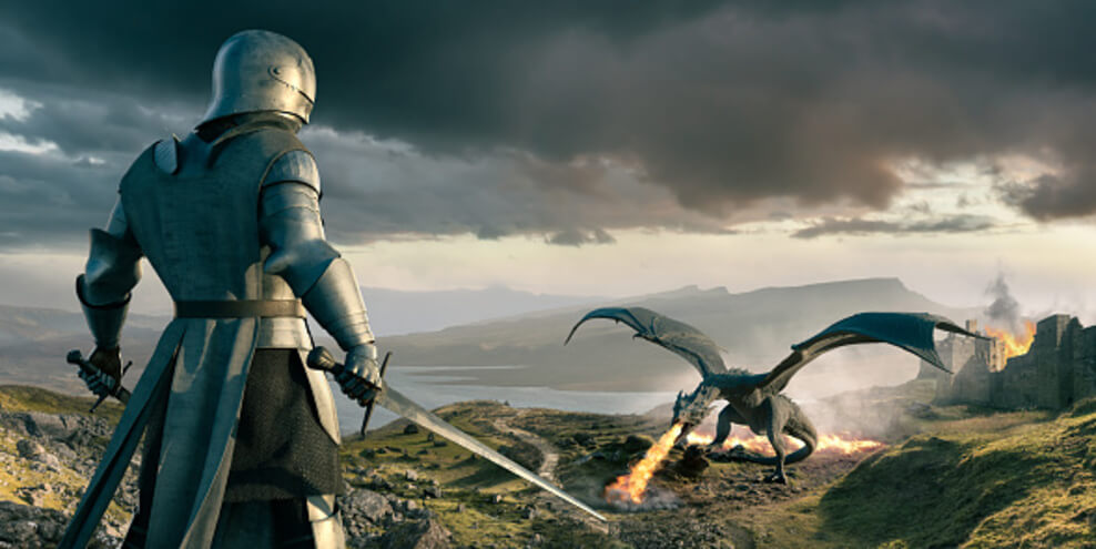 An image showing a knight with a sword ready to attack a dragon