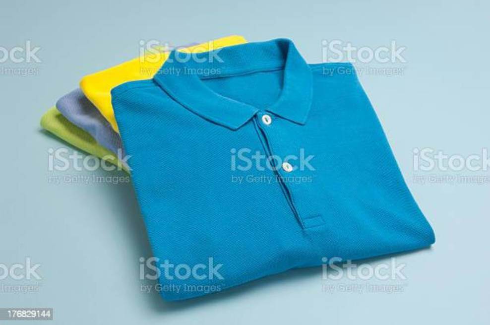 Polo T-shirts folded and placed against a white background