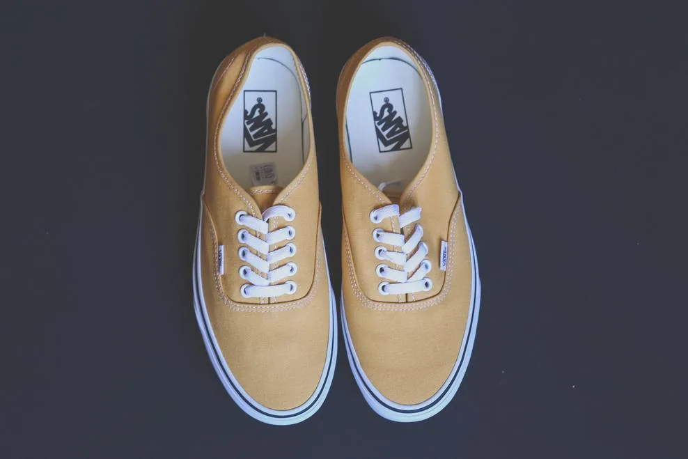 A photograph of Vans Authentic in yellow color