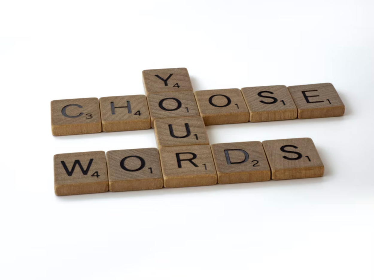 Tiles that say "Choose your words wisely"