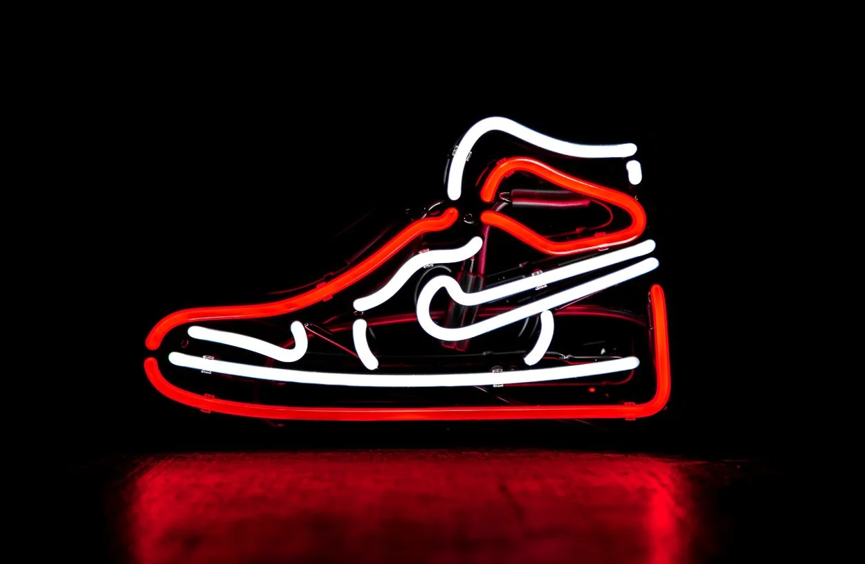 The shape of an Air Jordan sneaker in neon lights