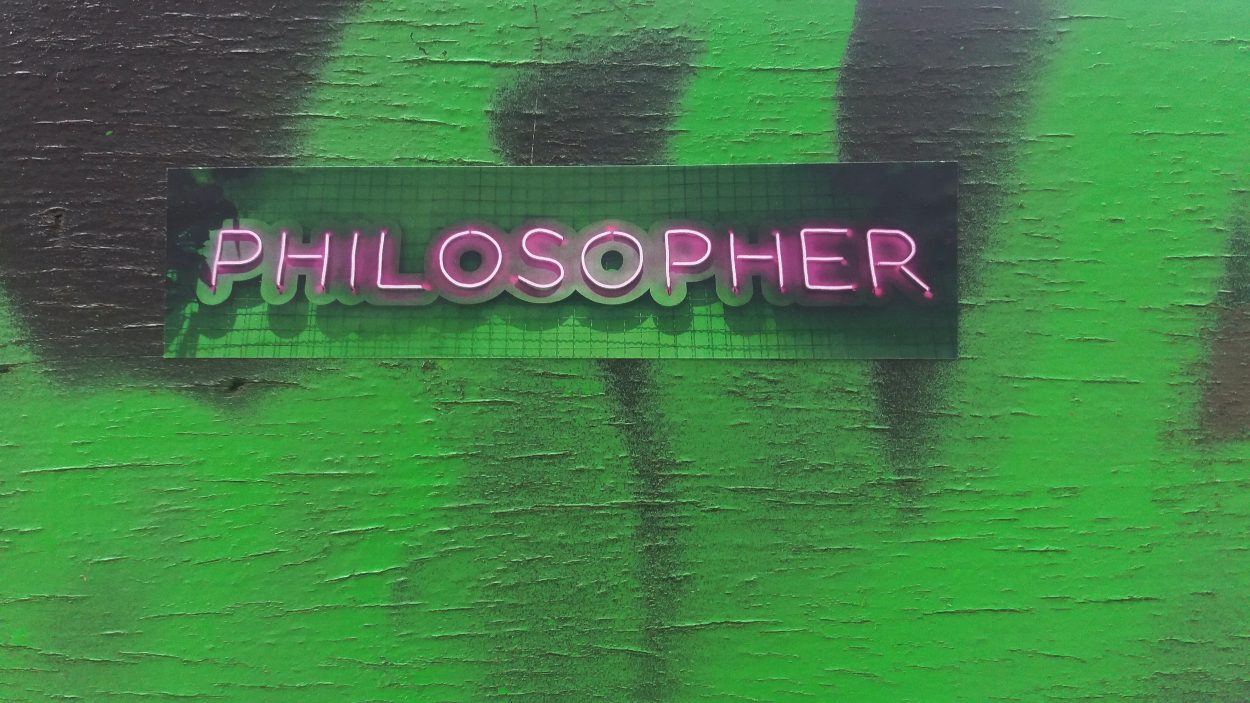 The words philosopher with a green backdrop