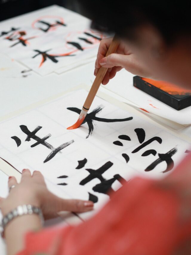 woman-writing-kanji-script