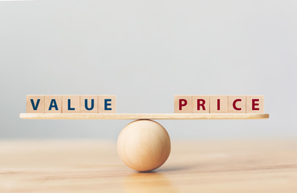 An image showing Value and price placed on a seesaw, balancing the seesaw.