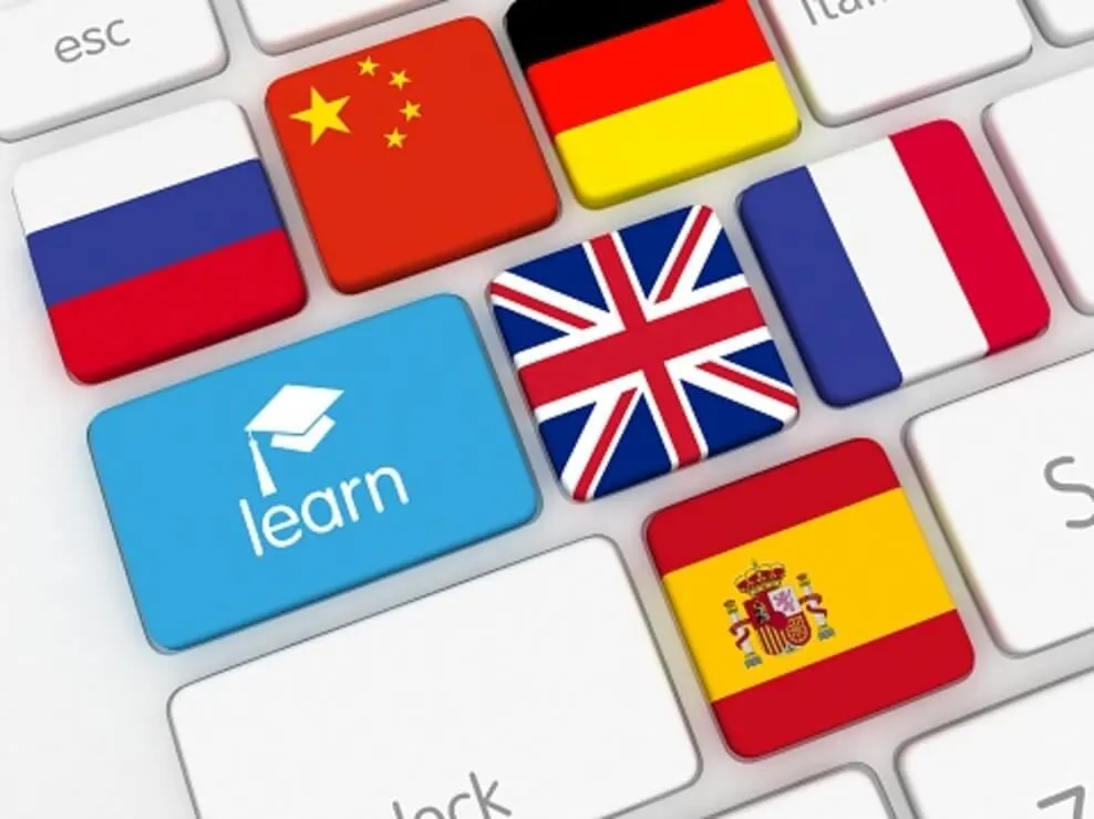 A keyboard represents online learning and several counties flags.