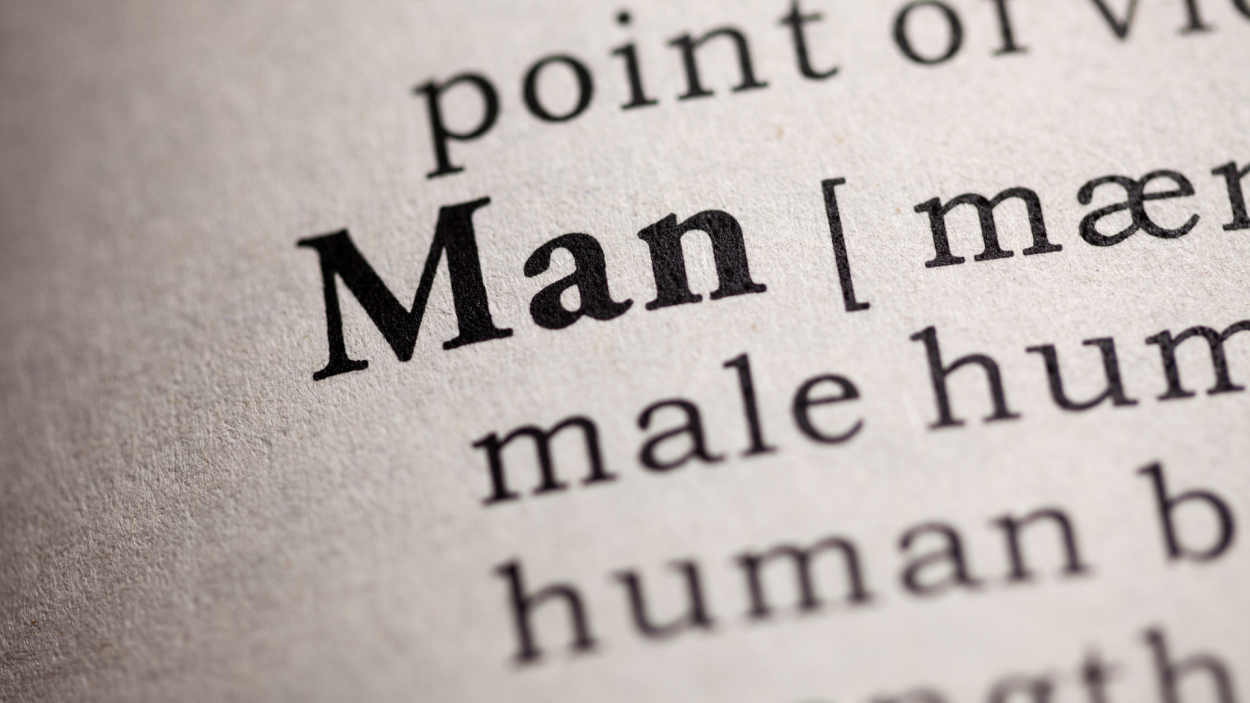 the word man in bold letters on a paper