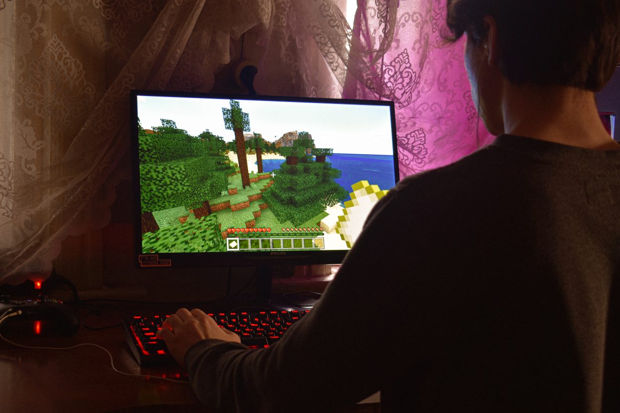 a person playing Minecraft on their PC