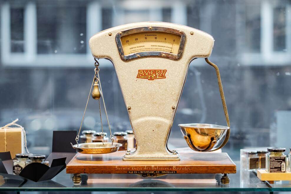 An image showing a vintage weighing balance.