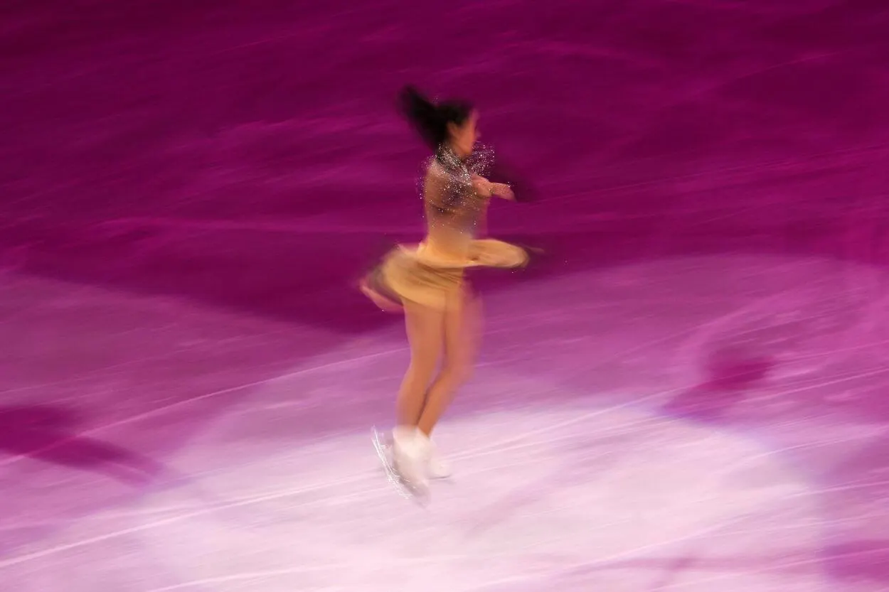 A figure skater performing a jump.