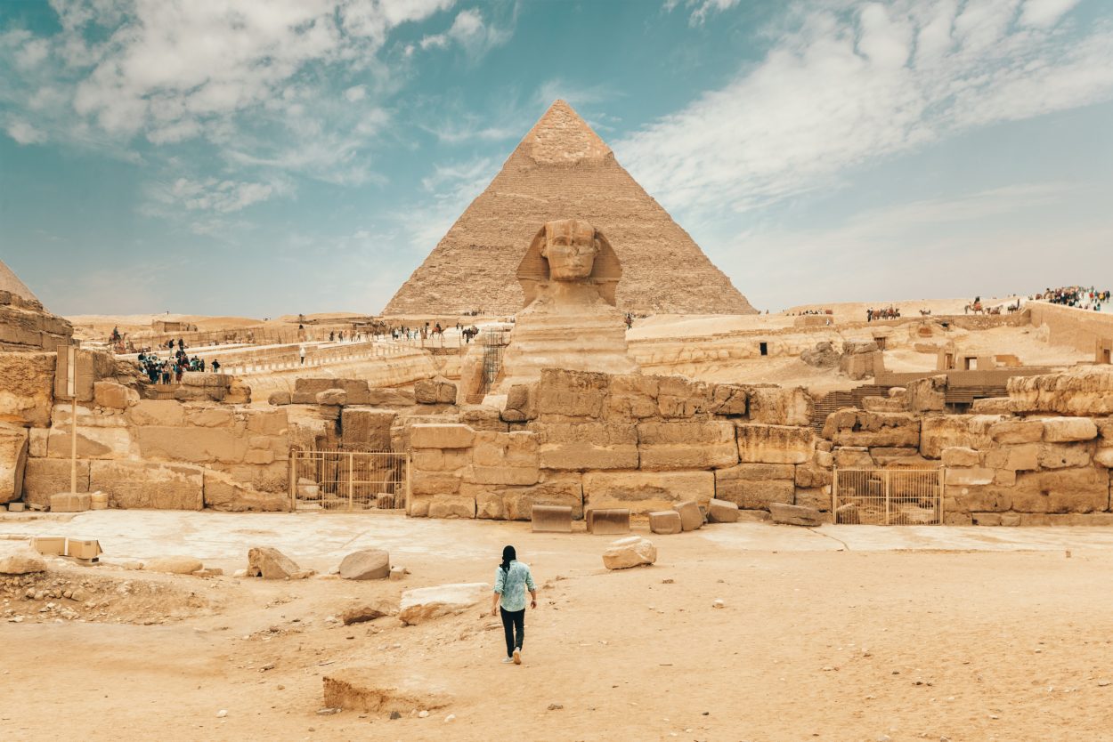 A person in Egypt in front of the Pyramid