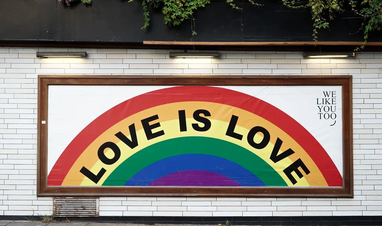A poster that says "Love is love"