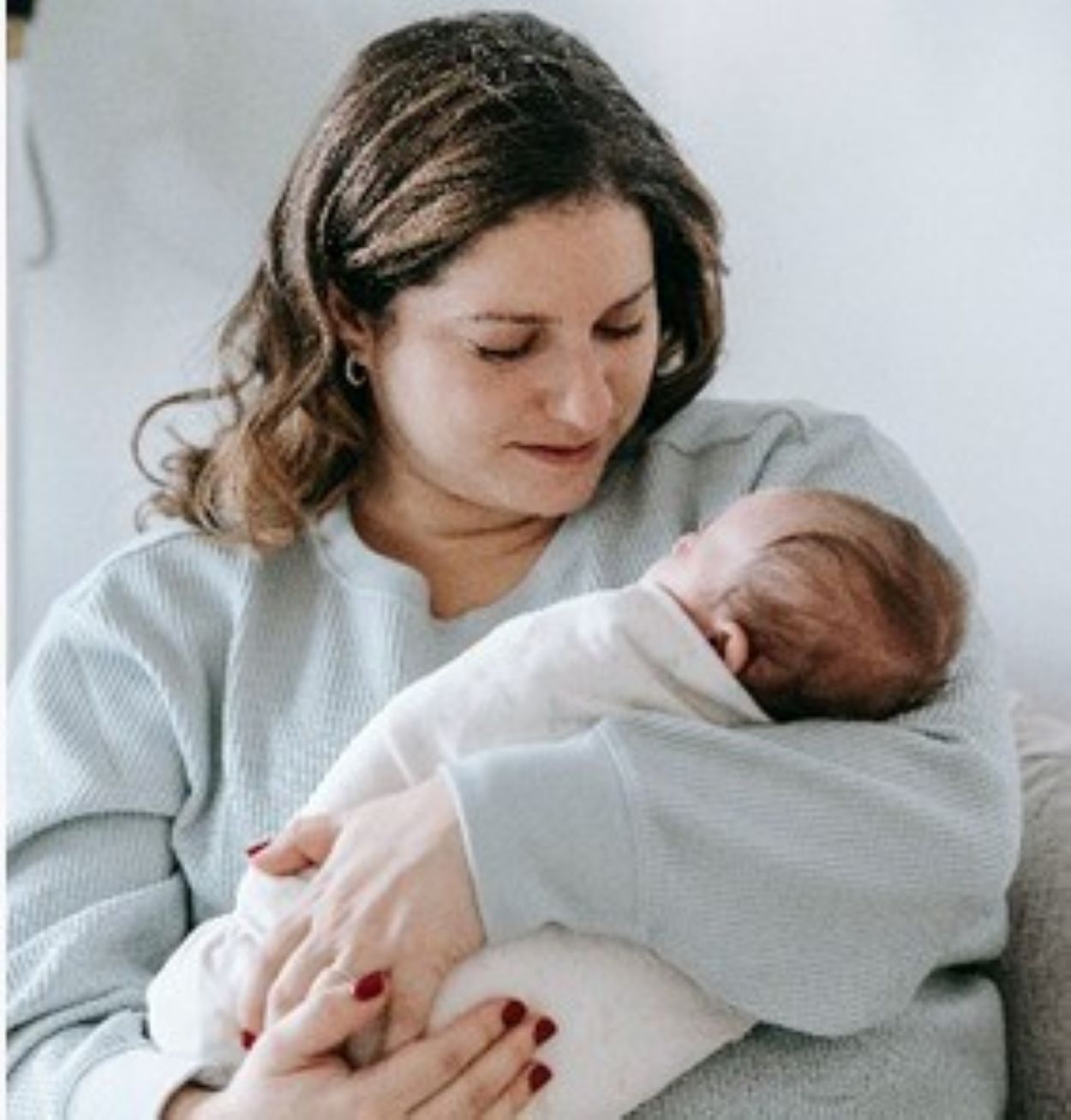 A woman holding her baby