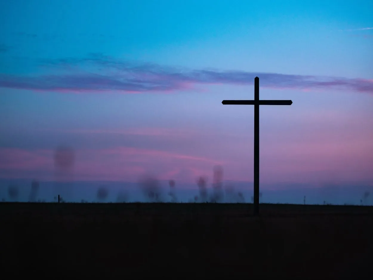 A silhouette of a cross