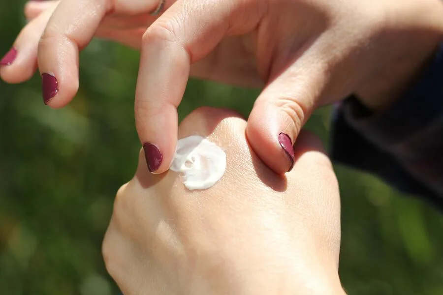 Hand cream is applied to the skin to protect it from the sun