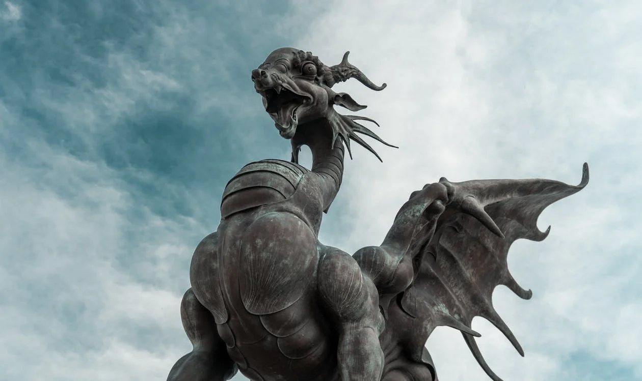 A stone statue of a dragon
