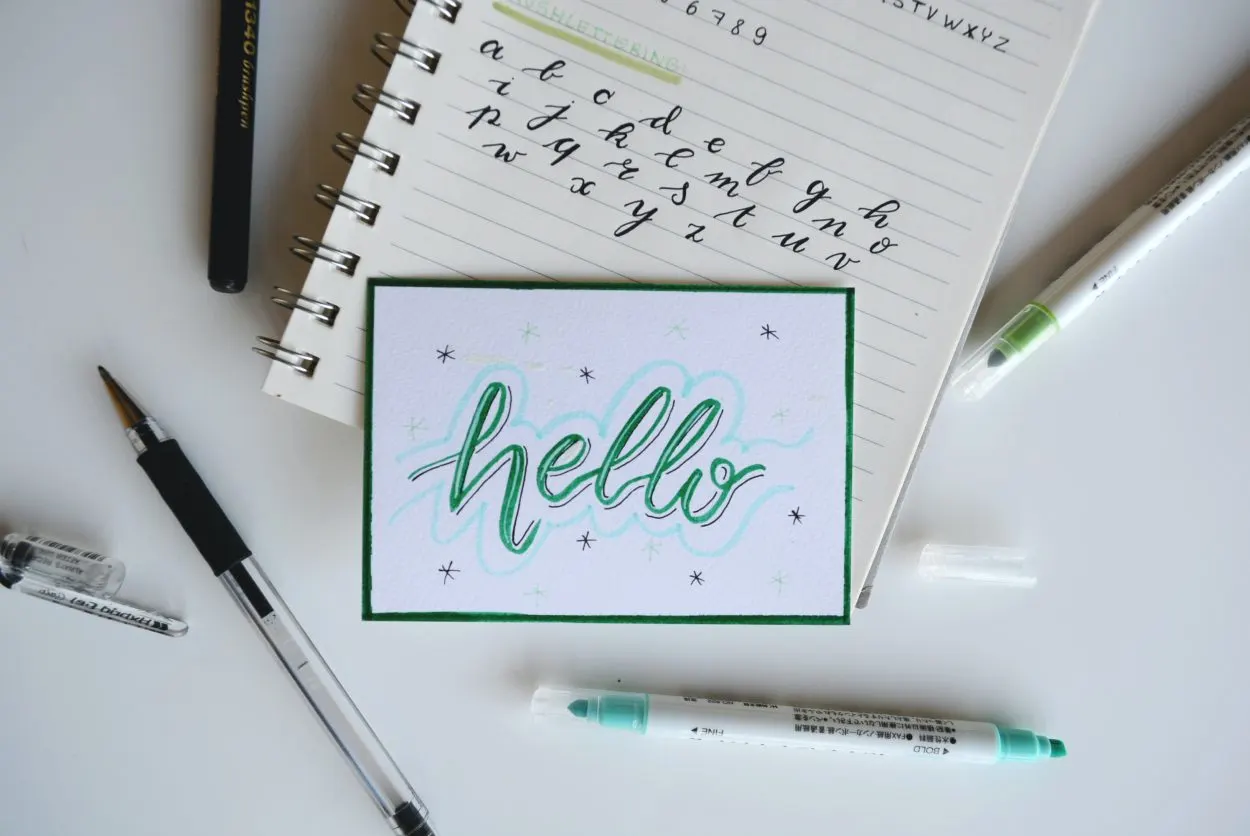 the words hello written on a small card