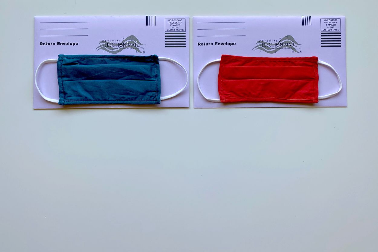 A red and blue masks on an envelope