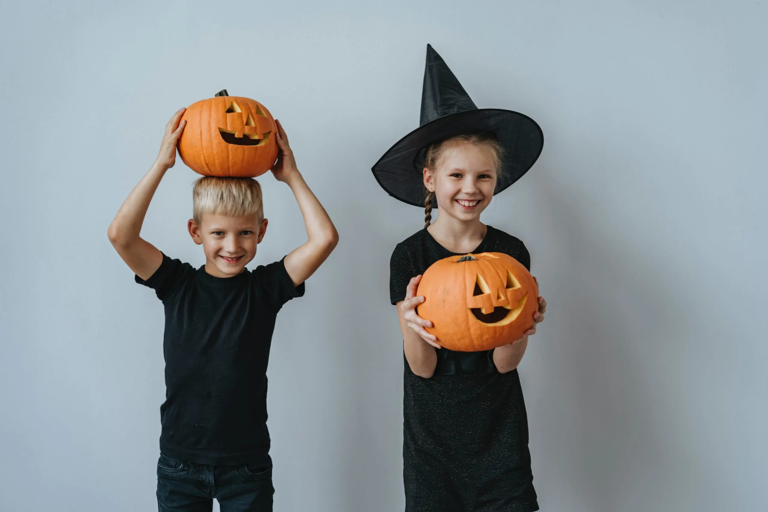 two kids with a pumpkin