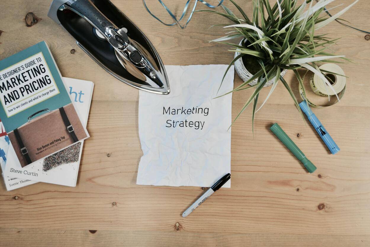 'marketing strategy' written on a crumpled piece of paper
