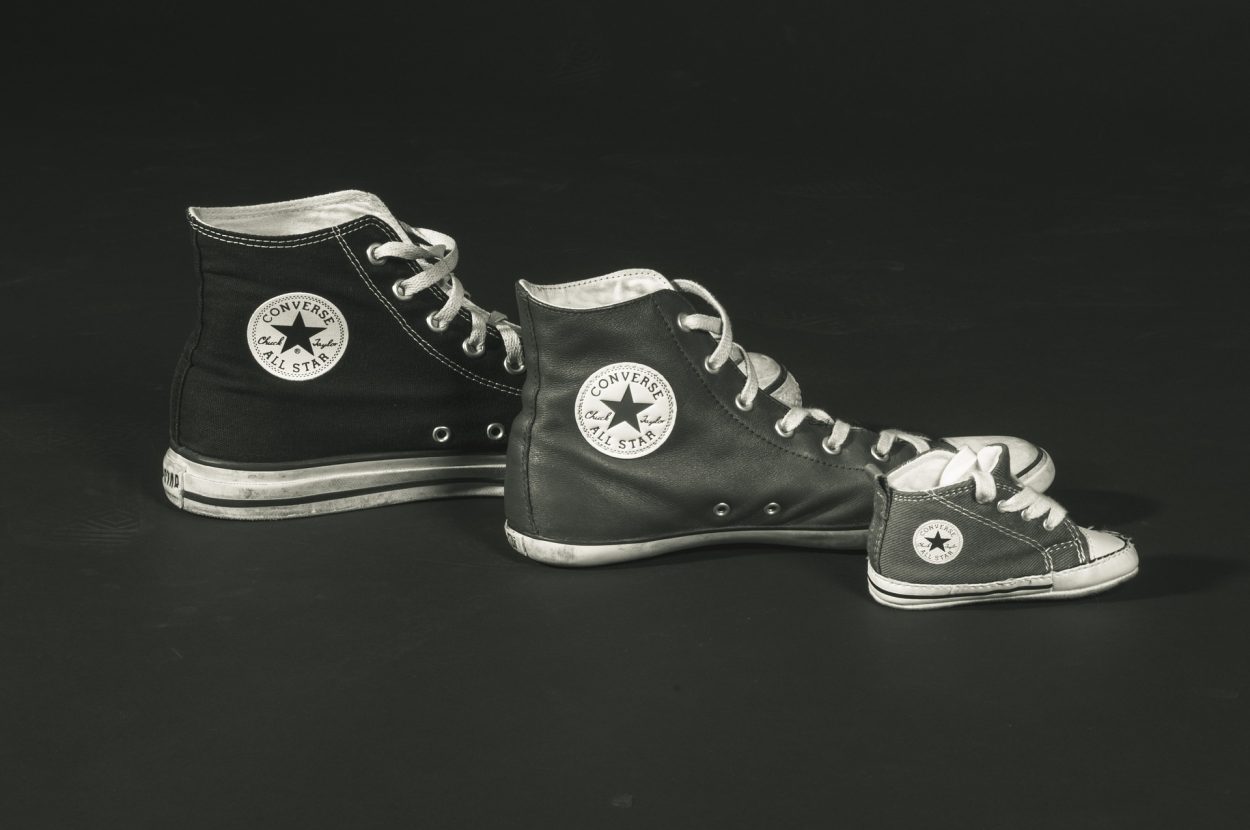 A picture of different sizes of Converse Chuck Taylors