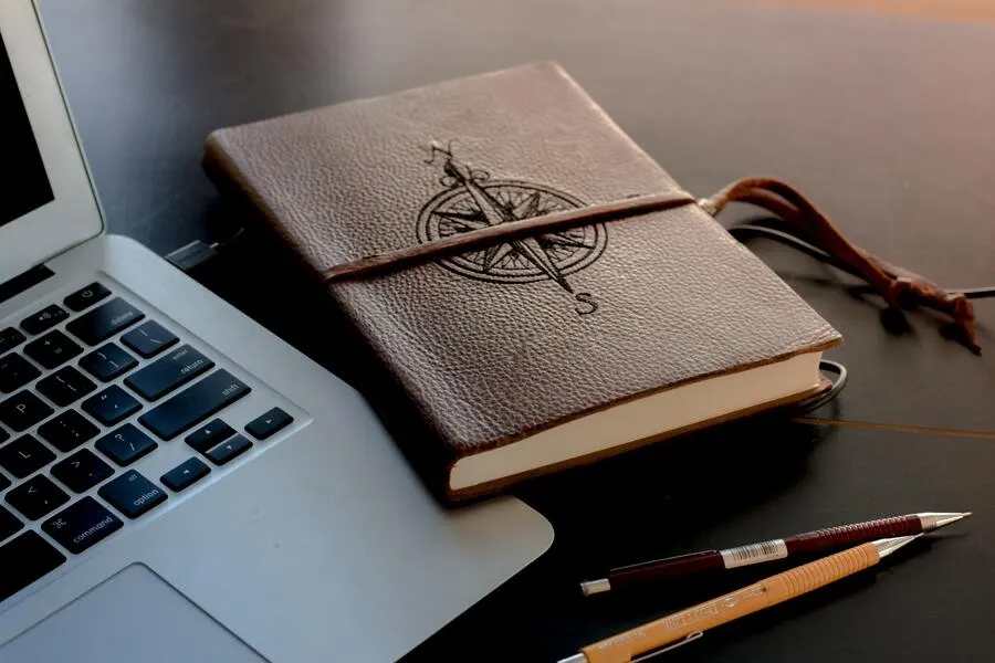 A Journal that Has A Compass As a Design To Make It More Journal Like