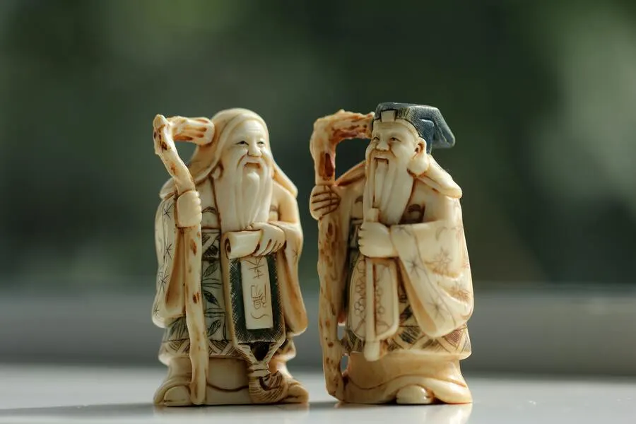 Two ancient ceramic figures.