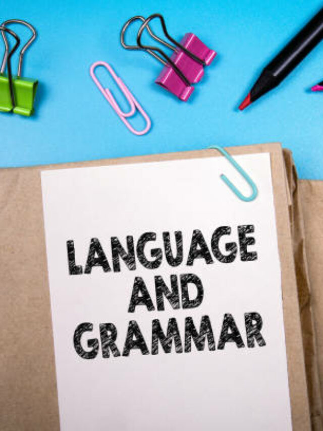 Language and grammar. Books and stationery on the office desk