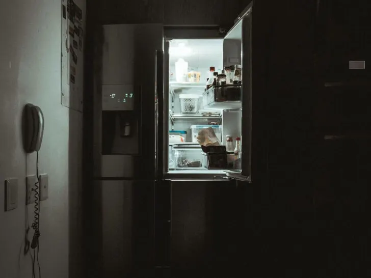 An image of a double door fridge with its door opened.