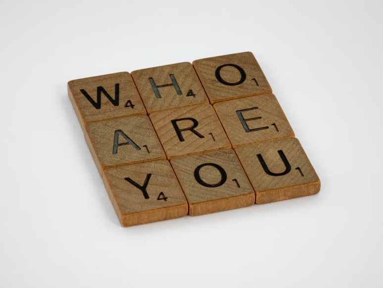 "who are you" written in wooden blocks