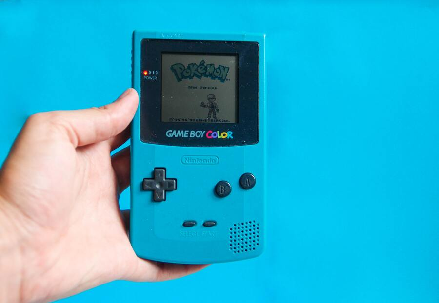 A Blue Nintendo Gameboy Color Playing Pokémon