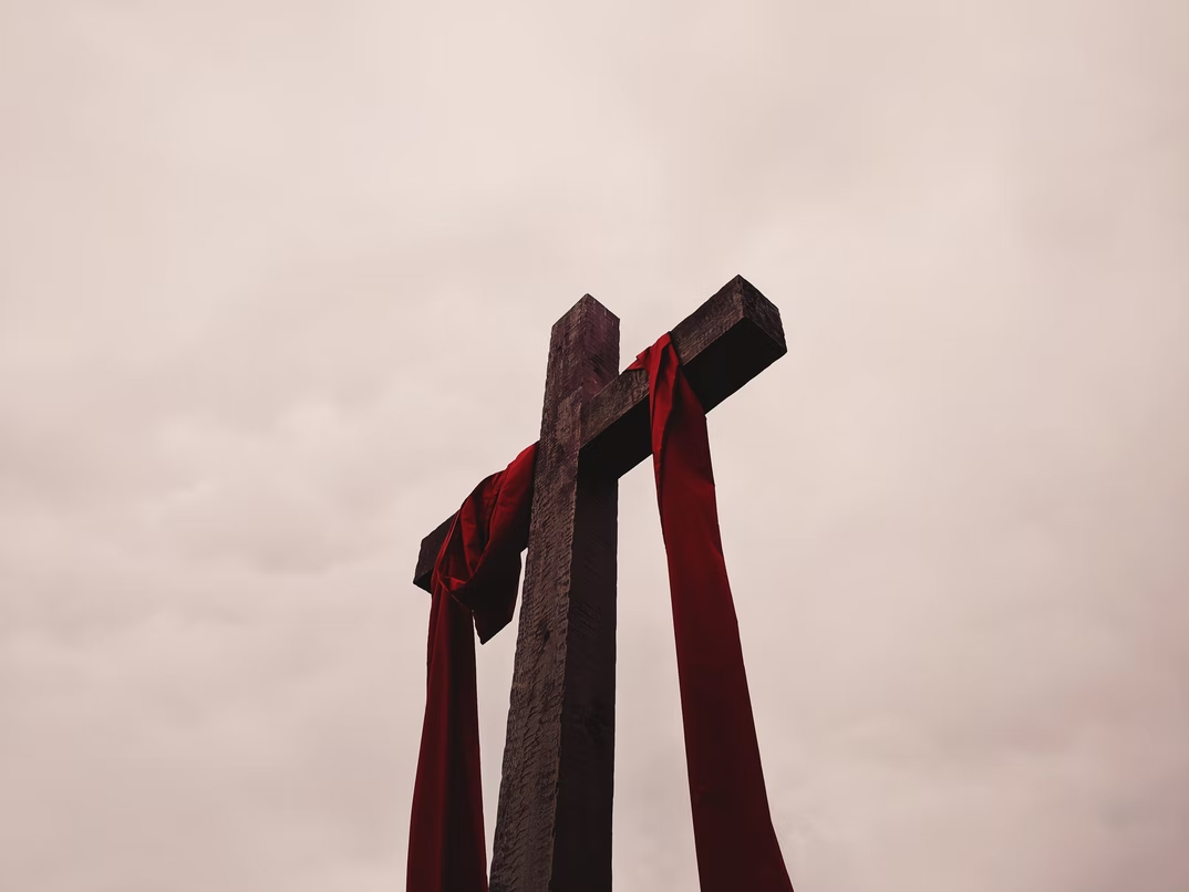 Holy cross with red cloth