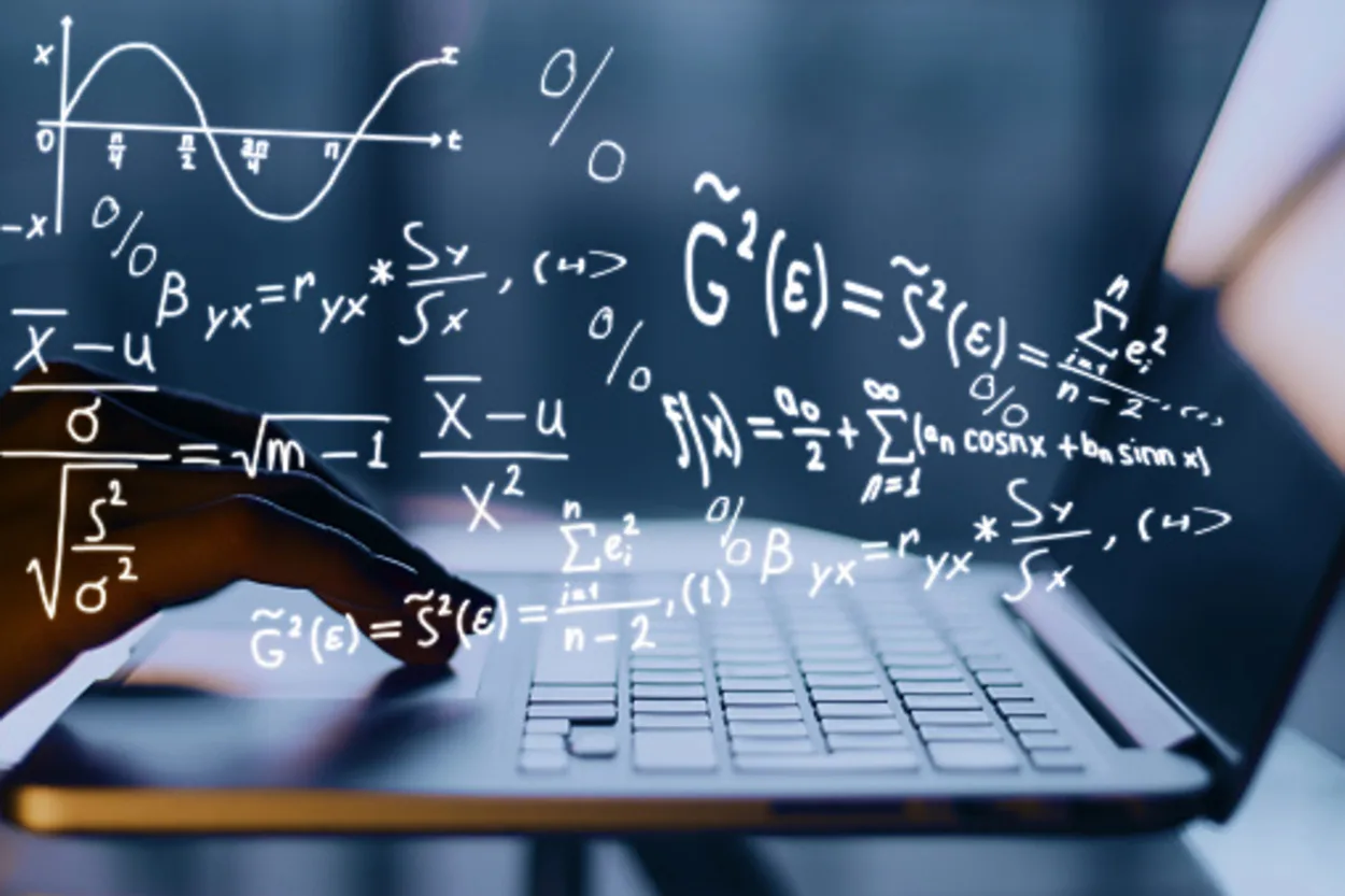A person using a lap[top and generating mathematical formulas