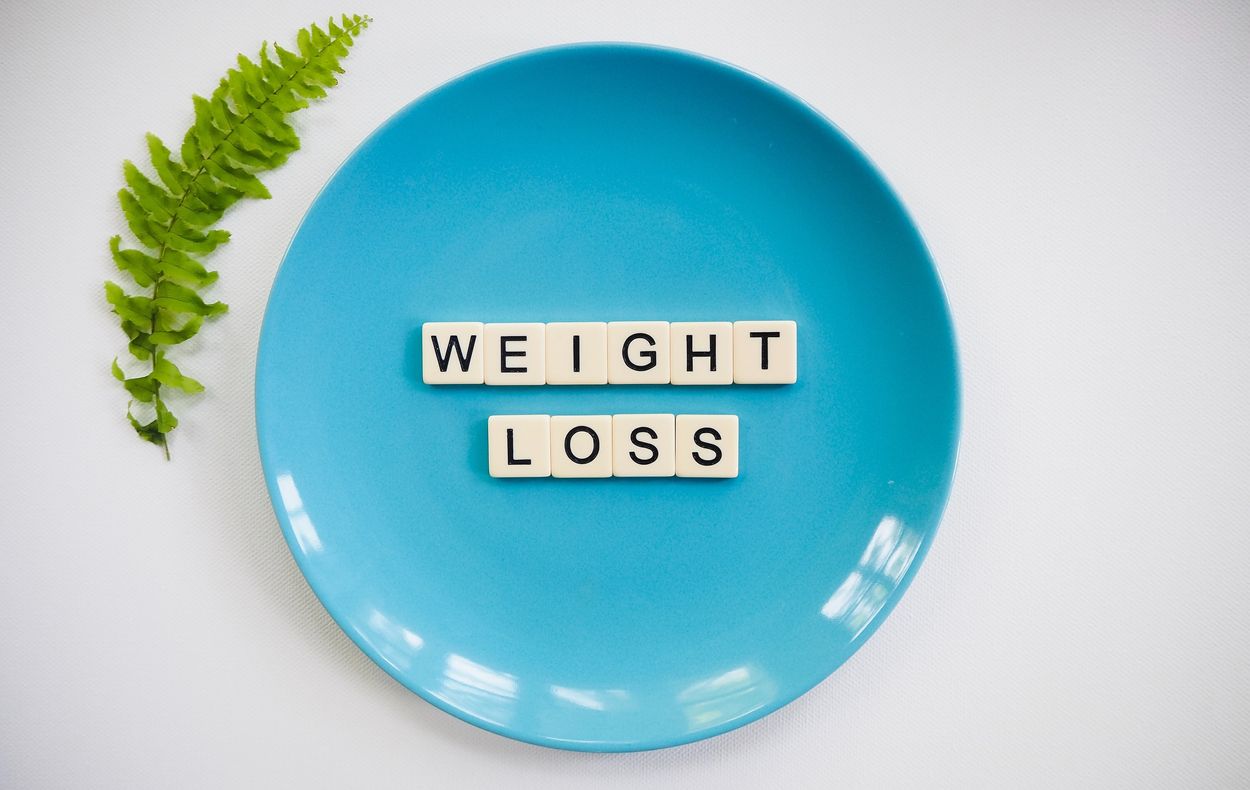 a plate that says 'weight loss'