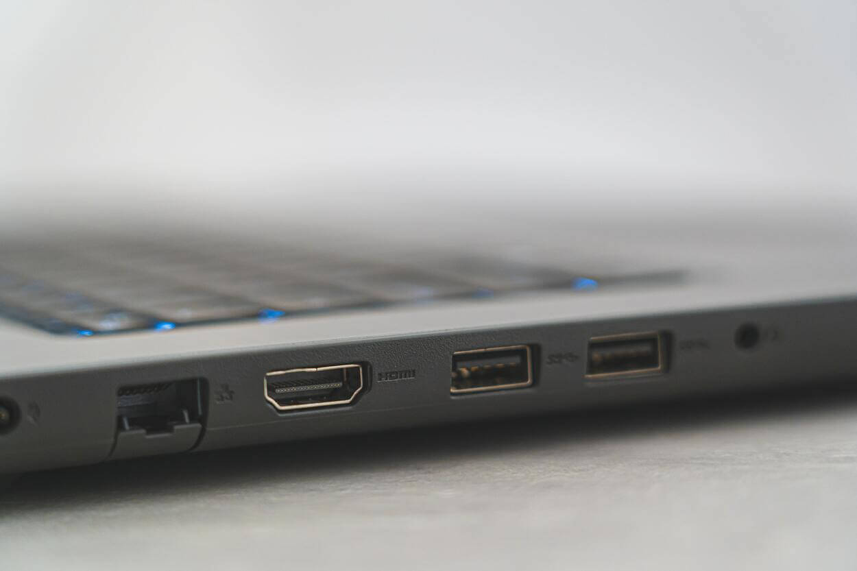 An image of the side of a laptop showing different types of USB ports.