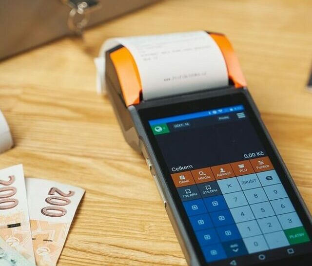 Image of a a machine along with some cash on a table.
