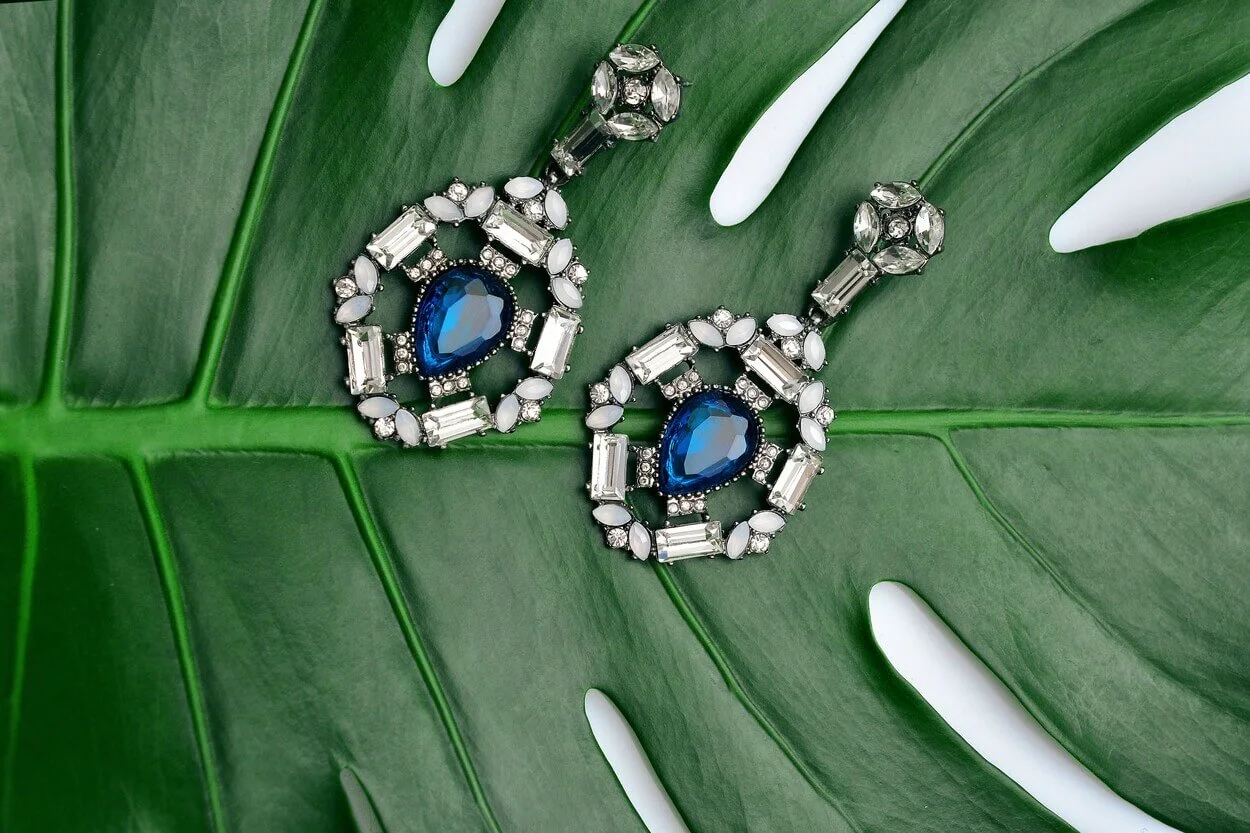 An image of a pair of silver earrings.