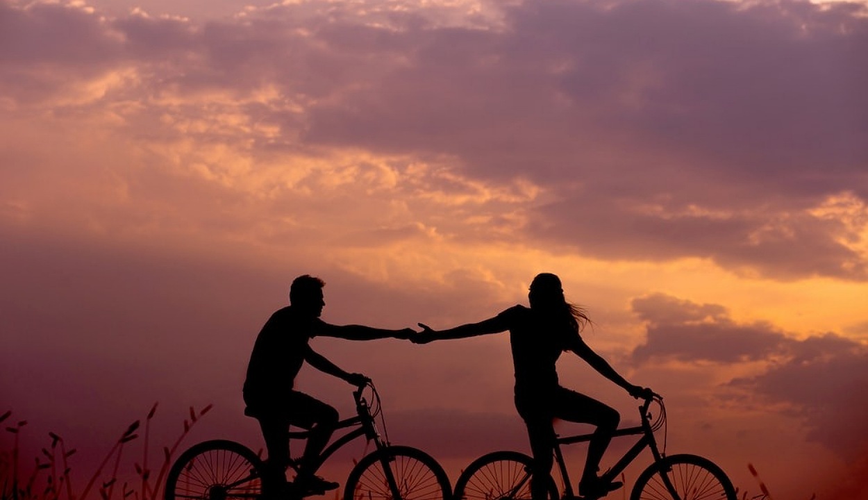 man and woman cycling