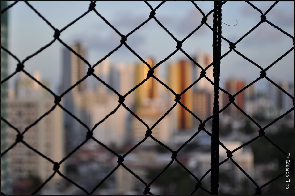 An image of fence made of Romex wire.