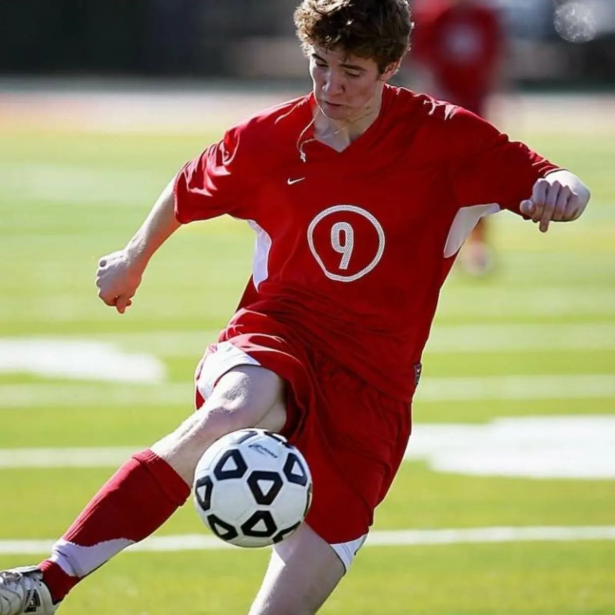 A player kicking a football