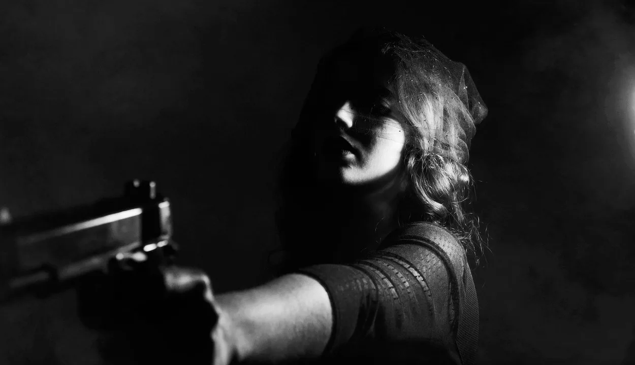 Girl holding a gun