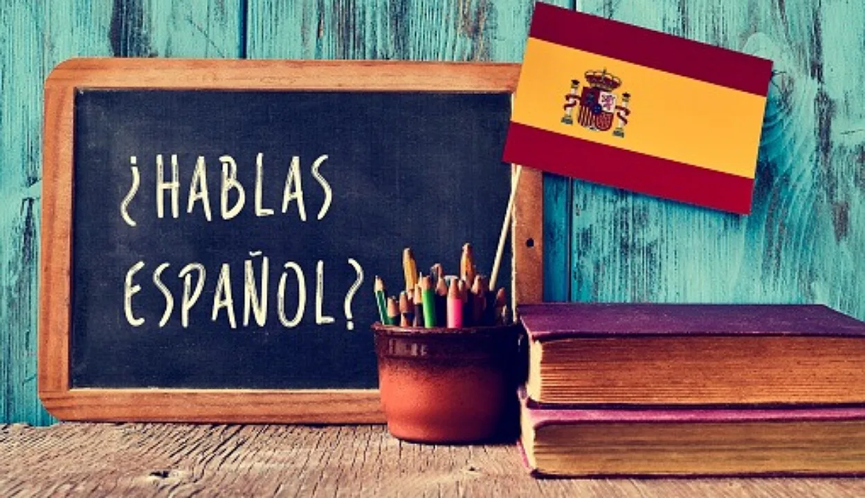 Spanish flag and writing on black board