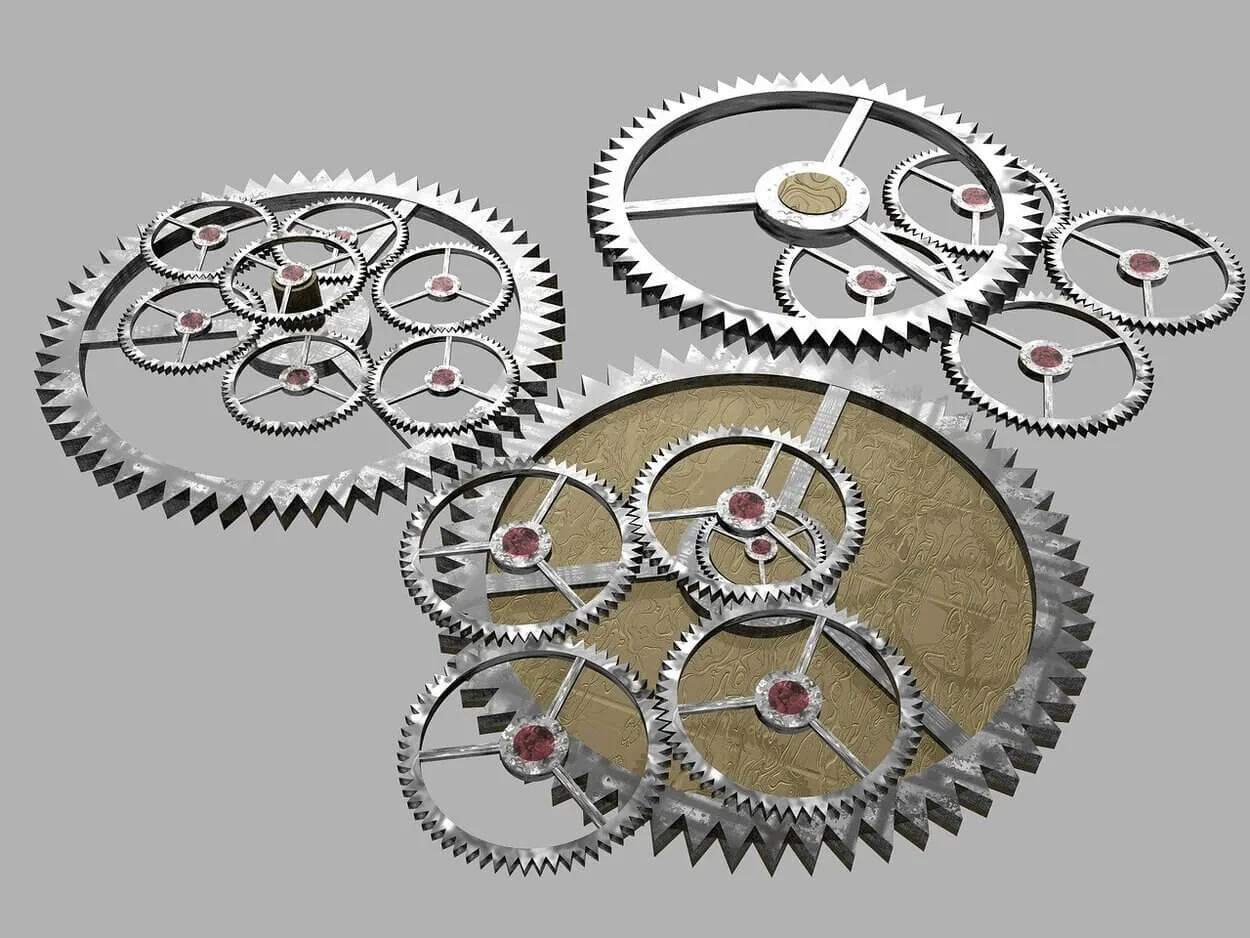 Image of different cogs and gears joined together.