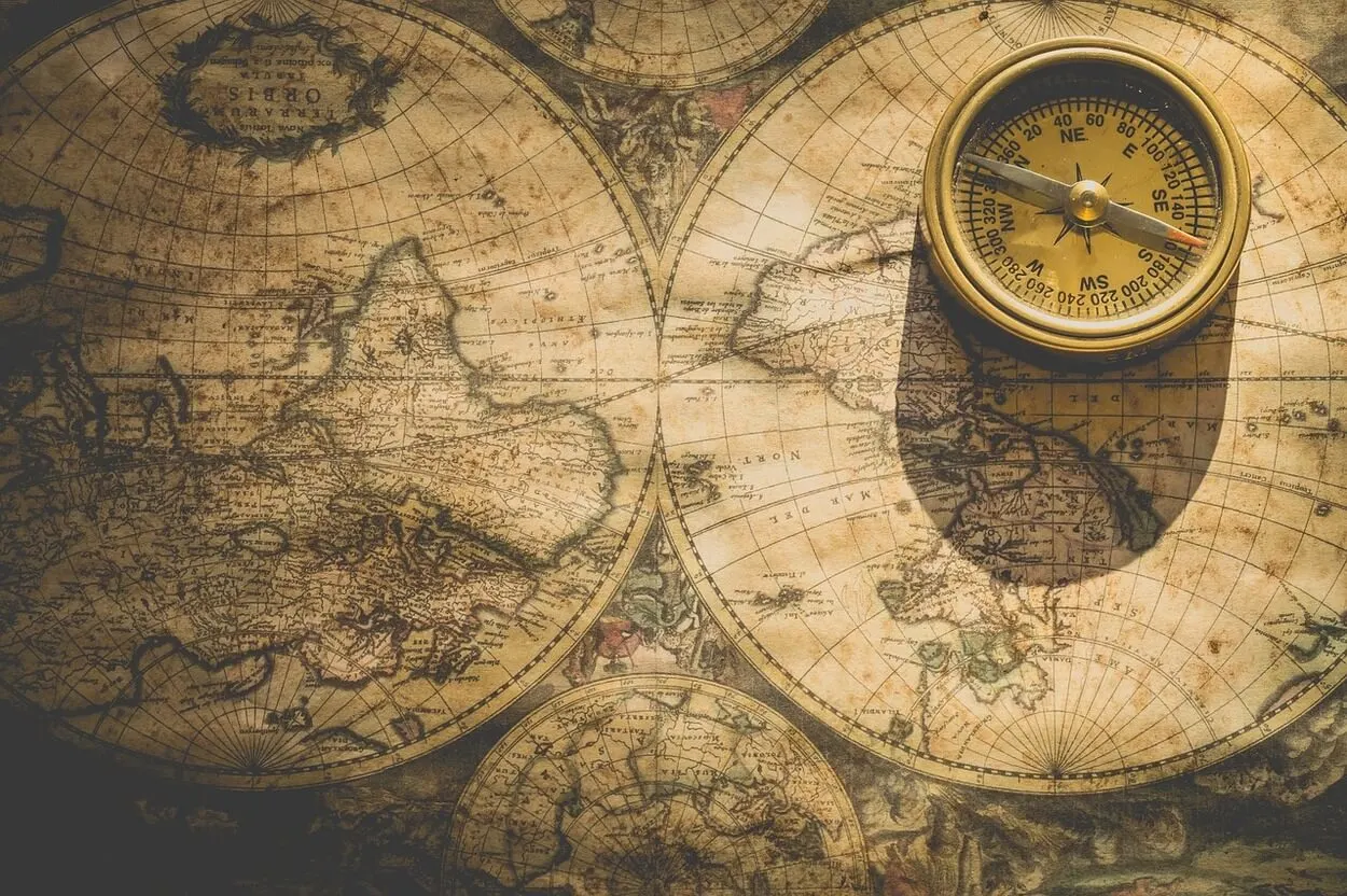 Image of a map and a compass.