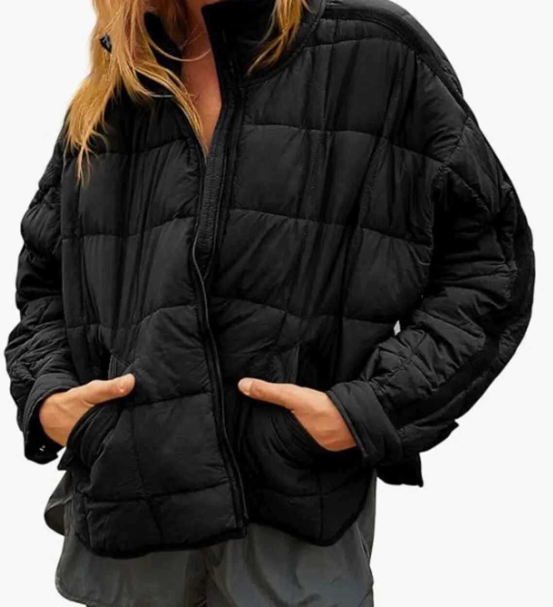 A woman wearing a black puffer jacket